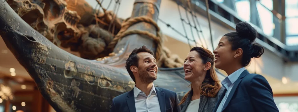 a group of business professionals excitedly discussing travel destinations around a large, nautical-themed anchor.